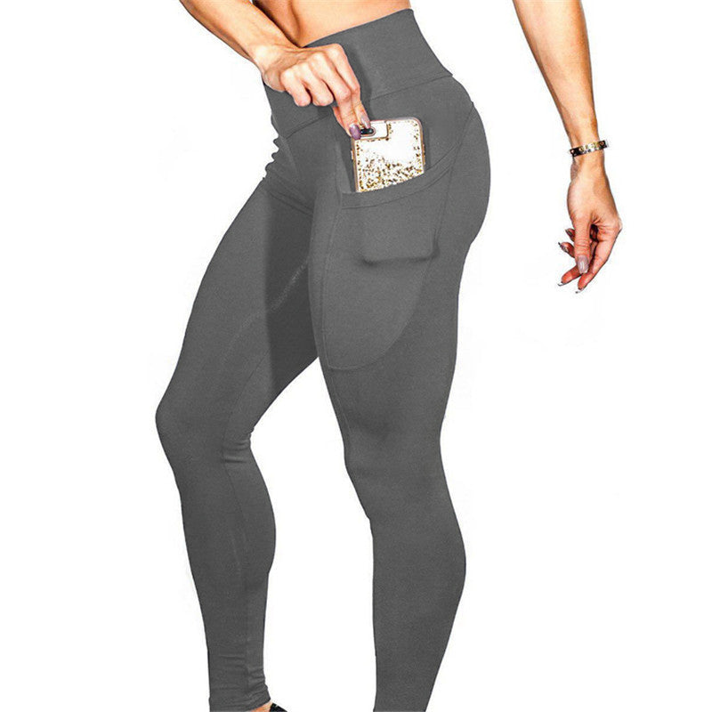 Mobile phone pocket female solid color leggings. Elastic high waist yoga pants
