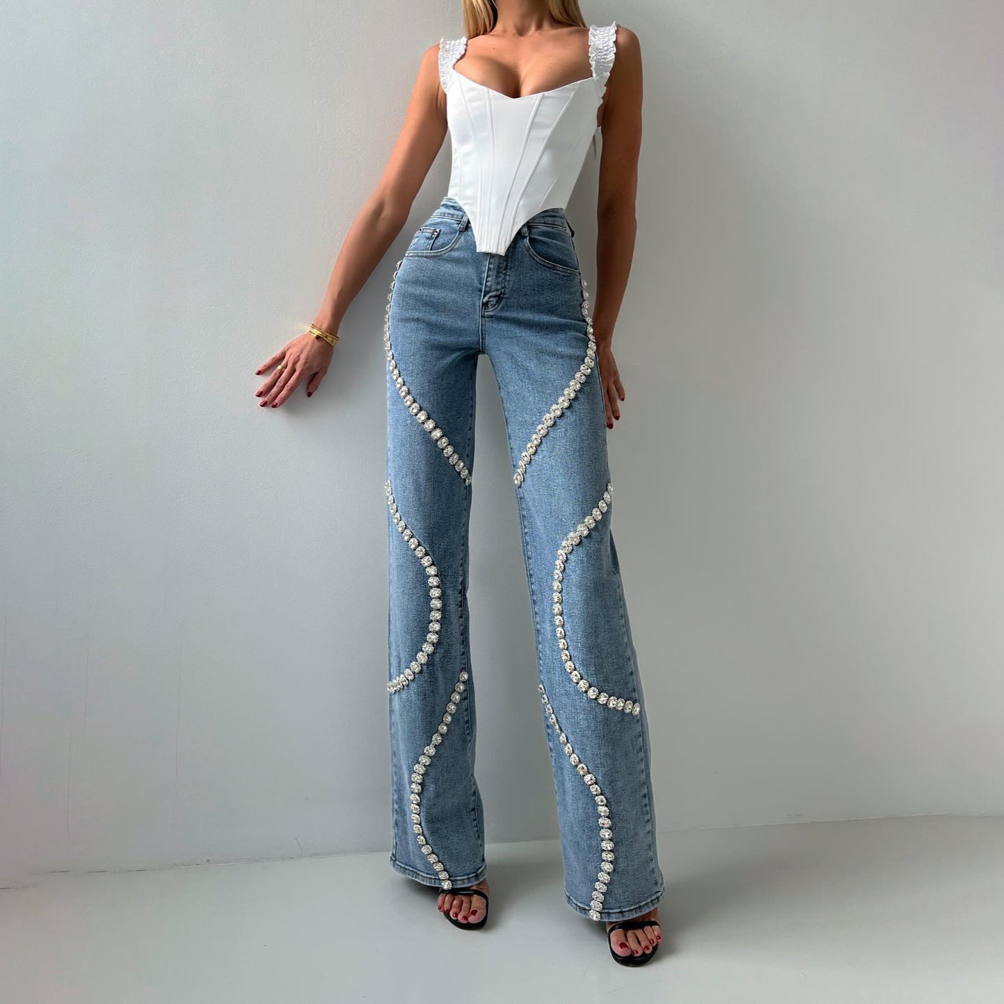 Loose Straight Leg Fashionable Casual Jeans. Pants With A Rhine Stone Denim Design Around Them.