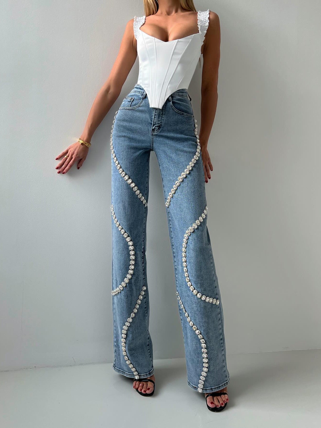 Loose Straight Leg Fashionable Casual Jeans. Pants With A Rhine Stone Denim Design Around Them.