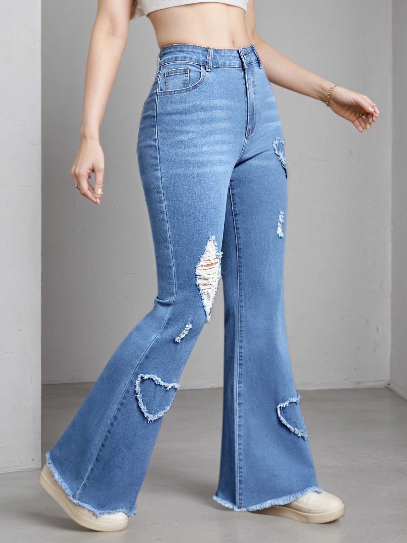 Light blue Women's High-Stretch Flare Jeans. Distressed Denim Bell Bottoms
