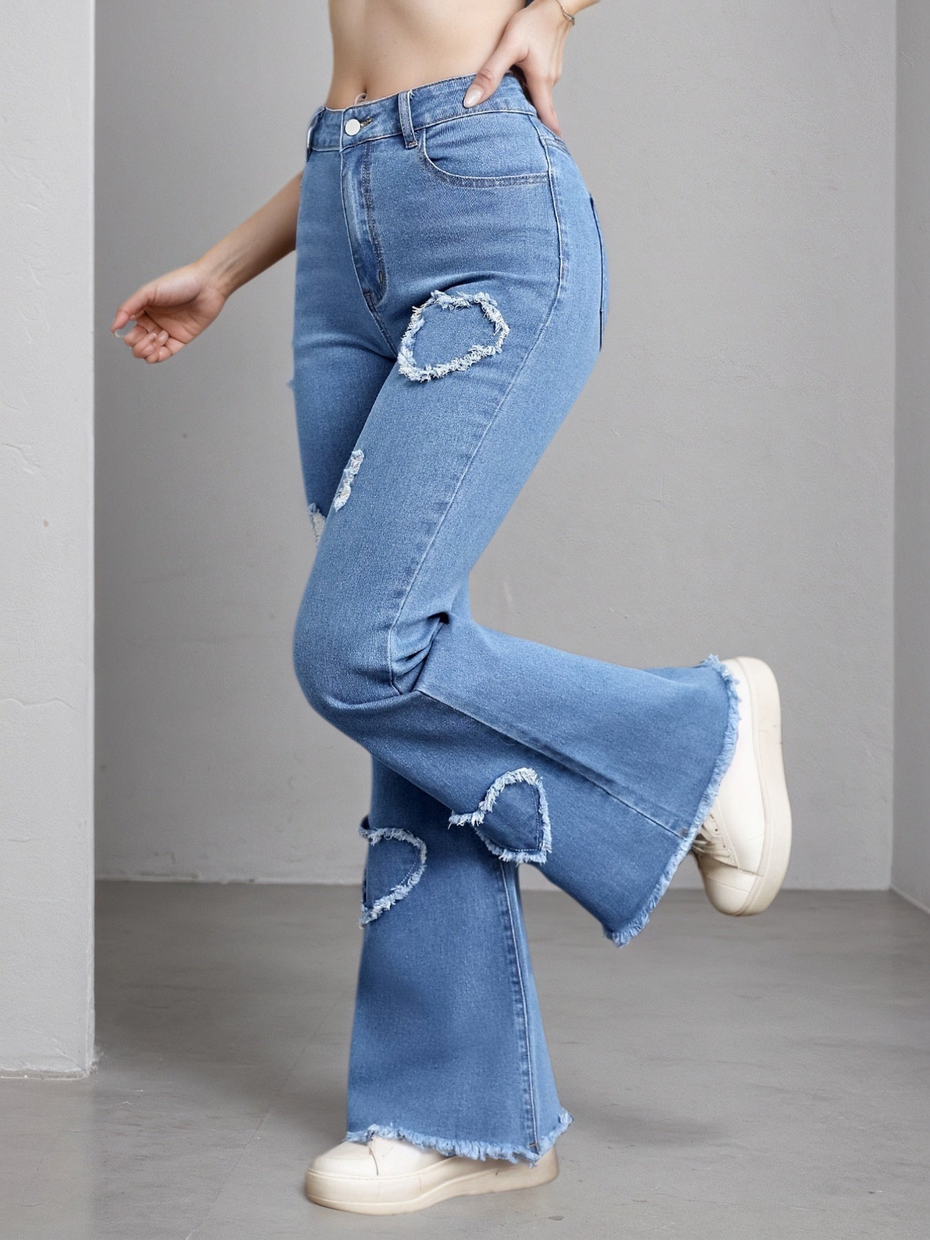 Light blue Women's High-Stretch Flare Jeans. Distressed Denim Bell Bottoms