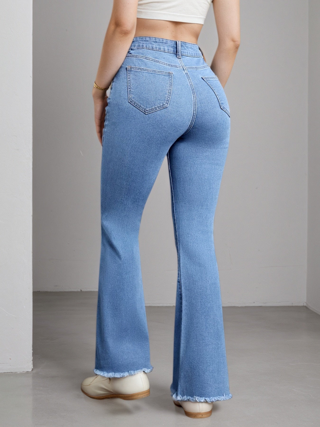Light blue Women's High-Stretch Flare Jeans. Distressed Denim Bell Bottoms